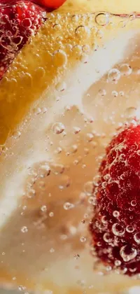 Looking for a lively and refreshing phone wallpaper? Look no further than this vibrant slice of fruit in a glass of water