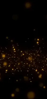 This phone live wallpaper features a visually stunning dark background blended with mesmerizing gold dust and bubbles VFX