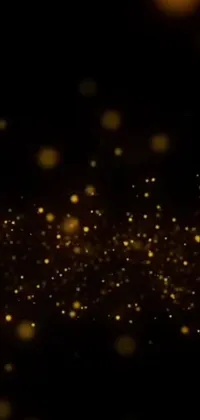 Featuring a black background with sparkling gold glitters, bubbles, fireflies, sparkling wisps and a YouTube thumbnail, the Phone Live Wallpaper is a captivating display for your device