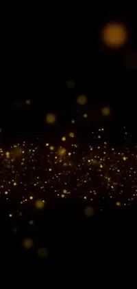 Feast your eyes on a spectacular phone live wallpaper, boasting a captivating black background accented with striking gold sparkles, bubbles, and pixie dust magic