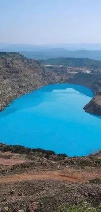 This live wallpaper features a stunning blue lake nestled atop a mountain, providing a serene natural scene for your phone's background