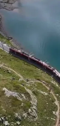 This breathtaking phone live wallpaper showcases a magnificent train journey through the Swiss Alps