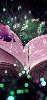This enchanting phone live wallpaper features an open book on a lush green field with intricate illustrations of magical creatures like fairies, mermaids and unicorns