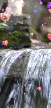 This live wallpaper depicts a beautiful waterfall set against a natural landscape