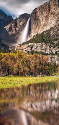 Enjoy a gorgeous live wallpaper on your phone with a picturesque body of water and a stunning waterfall in the background