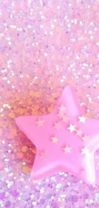 Get lost in the mesmerizing charm of this phone live wallpaper, featuring a close up view of a pink star on a pastel colored, glitter background