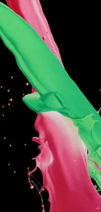 This live phone wallpaper features stunning, abstract digital art of pink and green liquid with bold black splashes