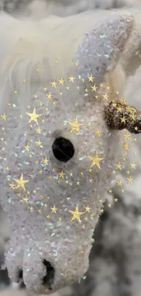 Add a touch of glitter to your phone's screen with this adorable close-up of a stuffed animal with shimmering glitter on its face