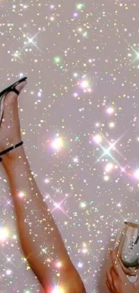 Enjoy a stunning phone live wallpaper featuring an elegant woman in high heels holding a glass of wine, with a dazzling holographic aesthetic inspired by the stars in the sky
