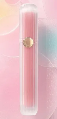This phone wallpaper showcases a tube of lipstick in close-up, adorned with golden details on a pink background