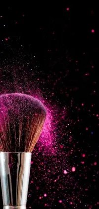 Experience the beauty of a shimmering makeup brush dusting your screen with this stunning live wallpaper