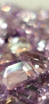 This phone live wallpaper boasts a stunning macro photograph of purple crystals on a table