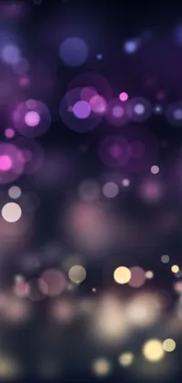 This live phone wallpaper features an enchanting and dreamy scene with a blurred photo of purple and black hues
