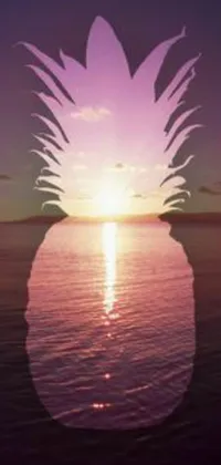 This stunning live wallpaper features a bold silhouette of a pineapple perched on a peaceful body of water