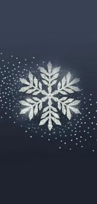 Looking for a stunning snowflake live wallpaper to adorn your phone screen? Check out this beautiful and intricately-designed digital artwork featuring a close-up view of a snowflake on a blue background
