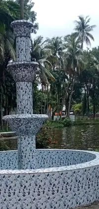 This exquisite live wallpaper depicts a serene park featuring a magnificent fountain with captivating detail