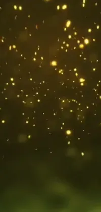 This live phone wallpaper showcases a stunning visual of yellow fireflies flying against a dark night sky