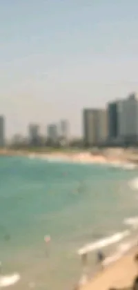 This is a stunning phone live wallpaper featuring an abstract image of a beach with a city in the background