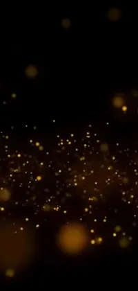 Add luxury to your phone with this stunning live wallpaper! Featuring a black background, gold lights, digital art, Pexels video screenshots, sand particles, fireflies, and a customizable clock, this wallpaper is perfect for anyone who wants a touch of elegance on their phone