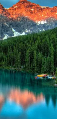 Looking for a serene and elegant wallpaper for your phone's background? Look no further than this beautiful live wallpaper, featuring a stunning body of water surrounded by mountains and trees