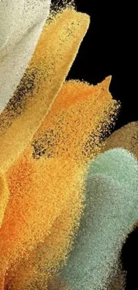 This phone live wallpaper features a close-up view of multi-colored powder on a black background