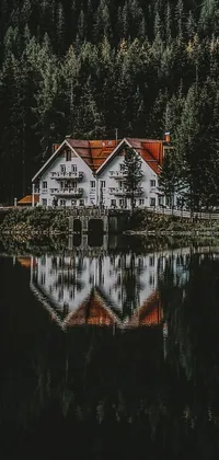 This beautiful live wallpaper features a stunning house perched atop a serene lake, surrounded by a lush forest