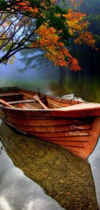 This phone live wallpaper showcases a charming fishing boat resting on top of a serene lake surrounded by a beautiful misty wood