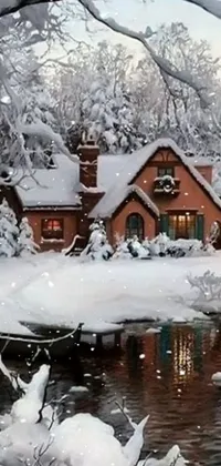 This phone live wallpaper features a cozy winter scene of a snow-covered house amidst a forest with a lake nearby