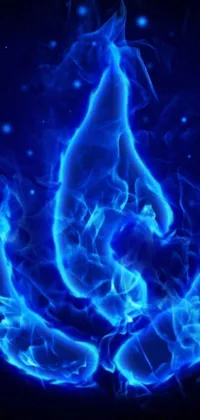Enhance your phone's aesthetic with a mesmerizing live wallpaper! Featuring stunning digital art, this wallpaper depicts a blue flame on a sleek black background