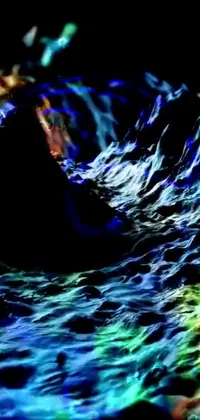 This phone live wallpaper features a surfer close up in a dark psychedelia style body of water