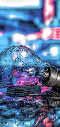 This phone live wallpaper is a stunning hyperrealistic close up of a light bulb on a table