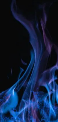 This phone live wallpaper showcases a stunning close-up of a blue-flamed fire, with a mesmerizing visual experience designed to enhance your home screen