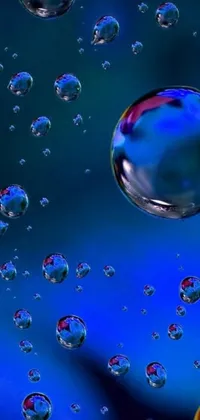 This dynamic phone live wallpaper features a mesmerizing cluster of bubbles gently floating on a deep blue surface