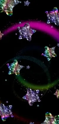 This live wallpaper for phones features a stunning black background adorned with twinkling stars and a vibrant rainbow