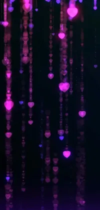 This phone live wallpaper depicts a dreamy and romantic scene of heart-shaped decorations hanging from the ceiling