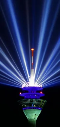 This stunning phone live wallpaper features a towering structure adorned with vibrant lights and a mesmerizing hologram