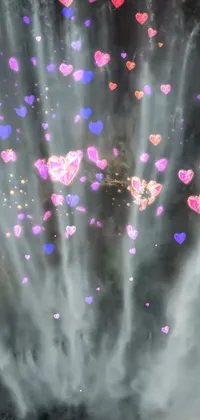 Enhance the look of your phone screen with this amazing live wallpaper featuring a stunning waterfall with dozens of heart-shaped particles floating around it
