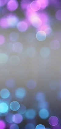 Get mesmerized by this stunning phone live wallpaper of purple and blue lights against a blue/grey background