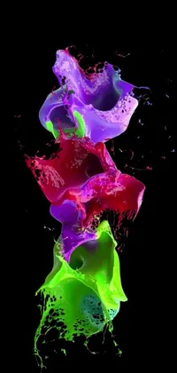 This mesmerizing phone live wallpaper features colorful paint splashes set against a black background, displaying a stunning digital art piece in 4K UHD