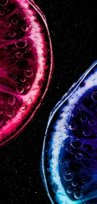 This phone live wallpaper showcases two fruit slices floating in space