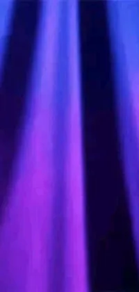 This dynamic live wallpaper showcases a man performing on stage in front of a microphone, accompanied by vibrant shades of purple and gradient blue