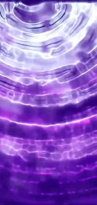Looking for a phone live wallpaper that is both mesmerizing and exciting? Look no further than this close-up purple circular object with a psychedelic acidwave design