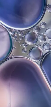 This live wallpaper features a stunning hyperrealistic microscopic photo of bubbles in organic mechanical shapes floating on top of each other