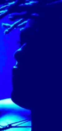 This dynamic phone live wallpaper depicts a person with distinct dreadlocks against a blue backlight