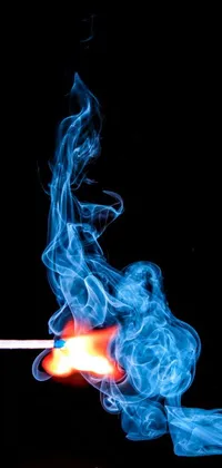 This phone live wallpaper features an auto-destructive art style, depicting a cigarette with blue smoke swirling around it