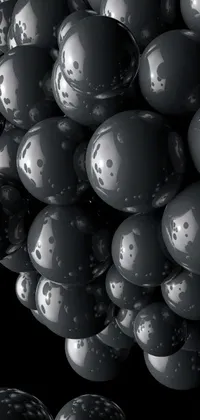 This live phone wallpaper depicts black and white balloons that seem to float in mid-air