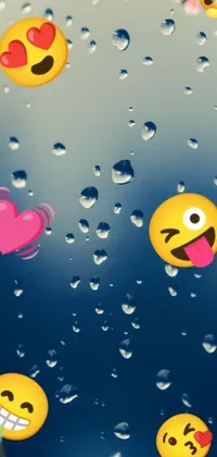 This amazing phone live wallpaper features a mesmerizing scene of cute and colorful emoticons floating in serene water droplets