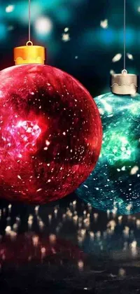 Decorate your phone with this festive live wallpaper featuring two colorful Christmas balls resting on a wooden table surrounded by playful decorations