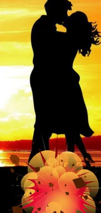 Get mesmerized by this beautiful phone live wallpaper which showcases a romantic couple kissing on a beach at sunset