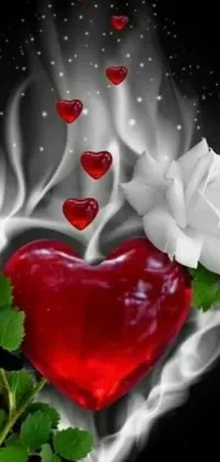 This striking phone live wallpaper showcases a beautiful image of a red heart and two white roses against a black background, accented by a holy flame spell